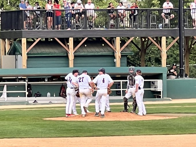 Brody Curtiss pitching, mound meeting